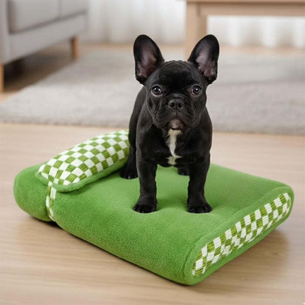Green Plush Pet Bed with Checkered Accents and Attached Pillow