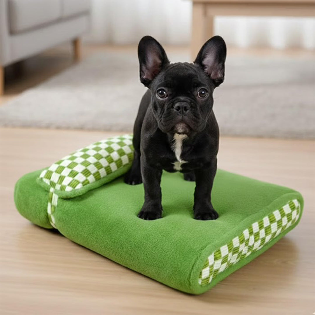 Green Plush Pet Bed with Checkered Accents and Attached Pillow
